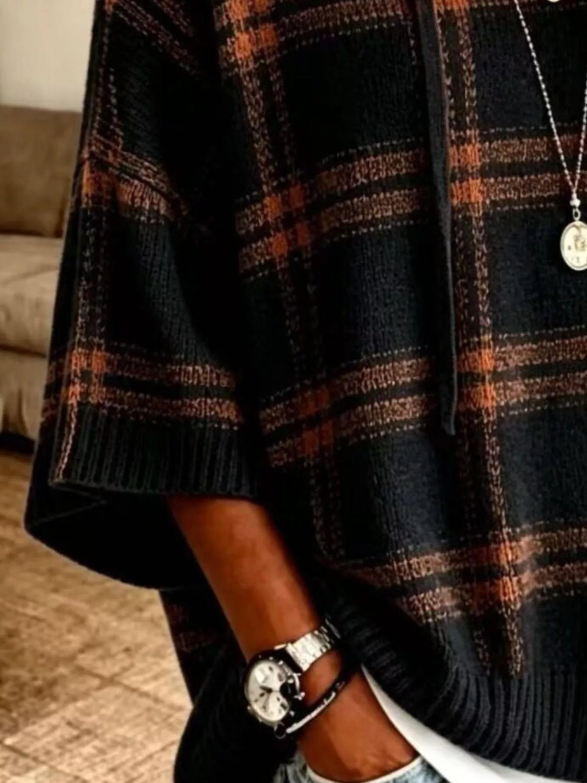 Black plaid hooded sweater, sleeve and hem detail