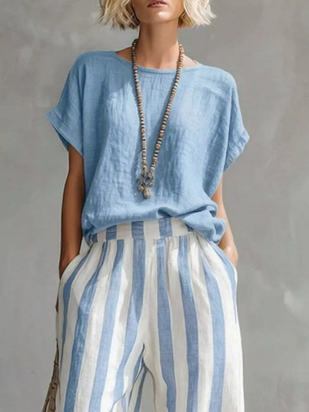 Light blue short sleeve top and wide-leg pants set — design and construction details