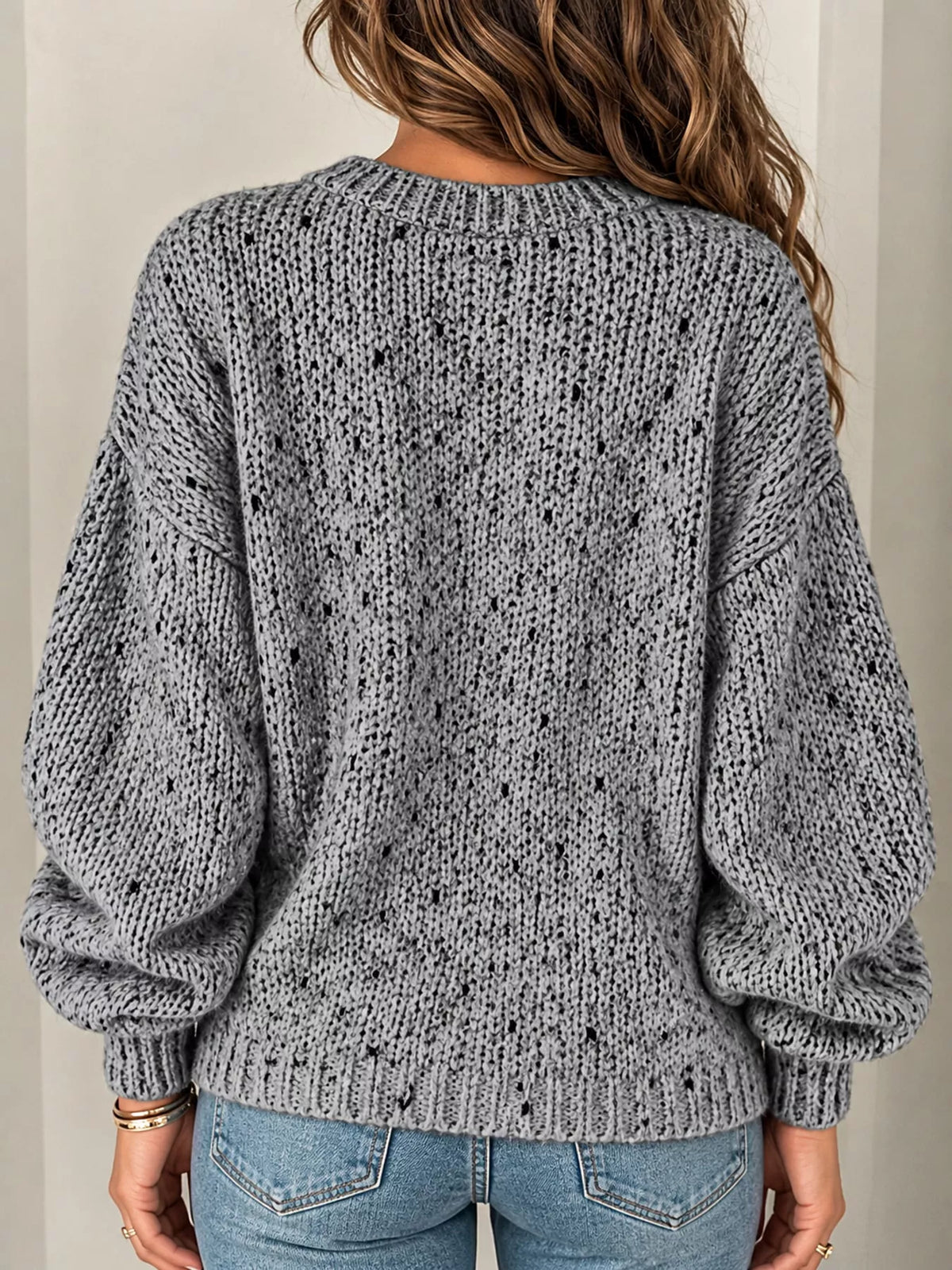 Gray chunky knit round neck sweater, back view
