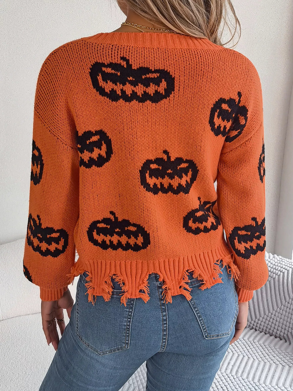 Pumpkin Distressed Hem Sweater in orange, back view