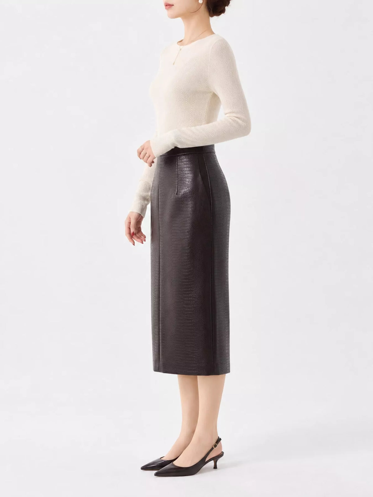 Cream herringbone knit sweater, side view
