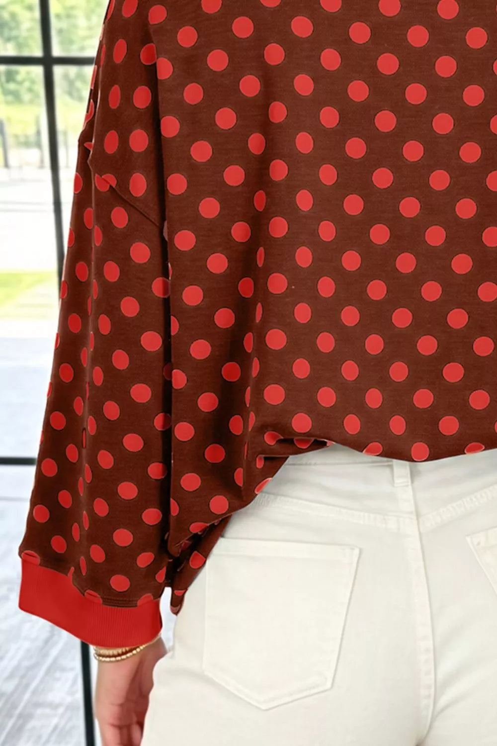 Polka Dot Sweatshirt in brown with red dots, construction detail