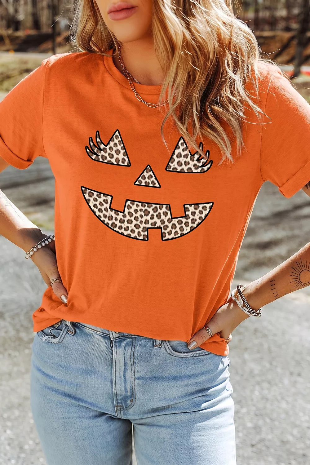 Women's Halloween Pumpkin Face Leopard Graphic T-Shirt in Orange, front view