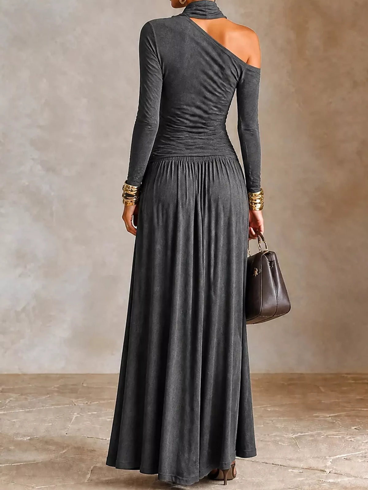 Dark gray asymmetric shoulder-cutout maxi dress with gathered skirt, back view