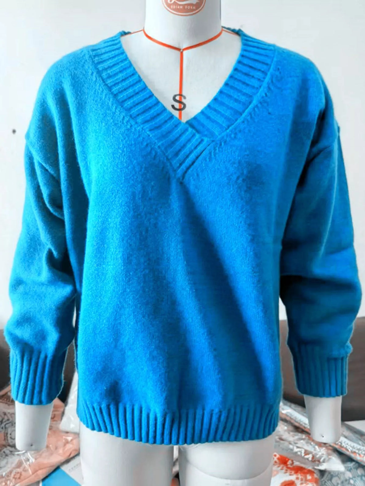 V-neck sweater, blue mannequin front