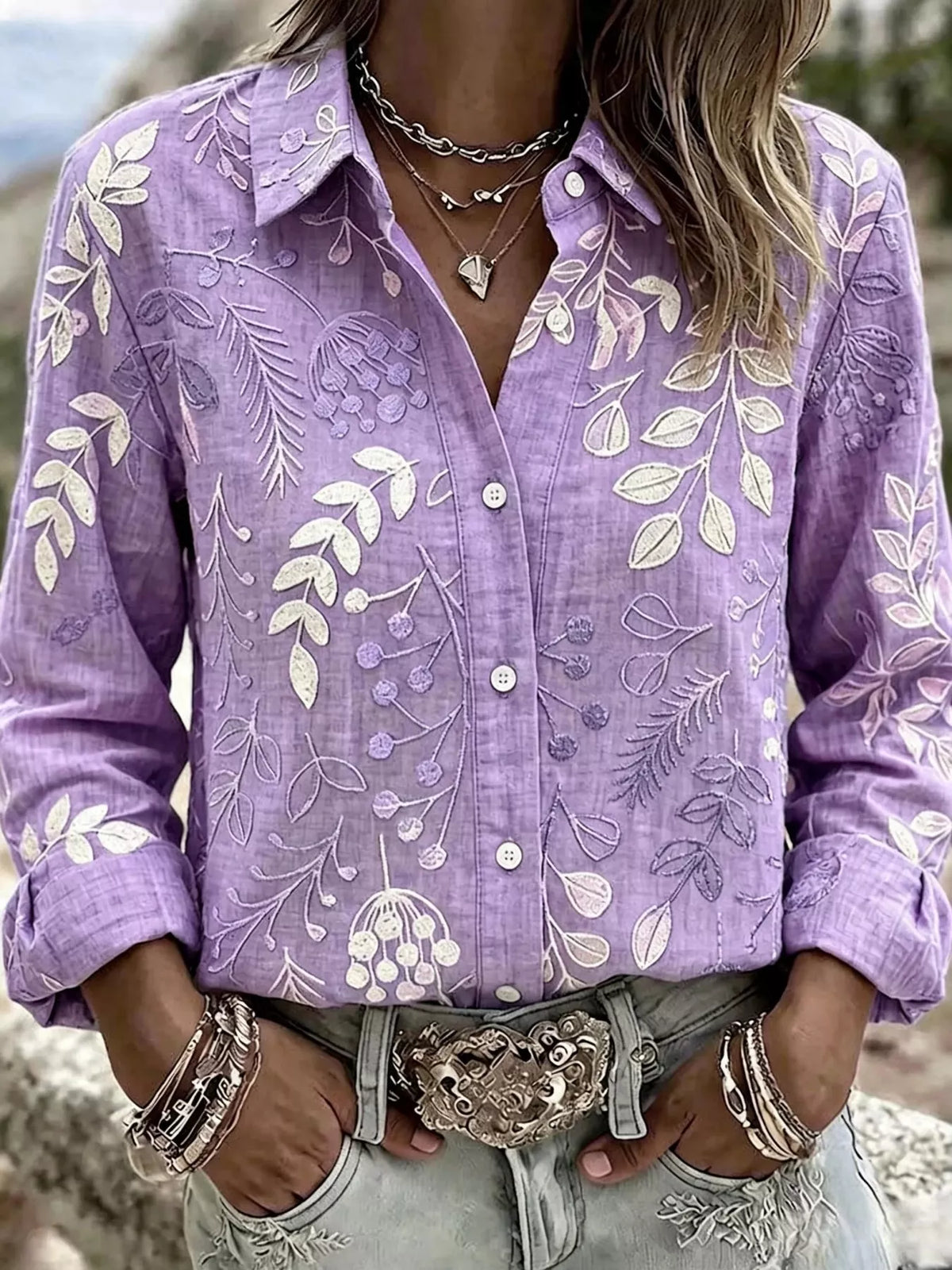 Purple leaf-embroidered button-down shirt, front view.