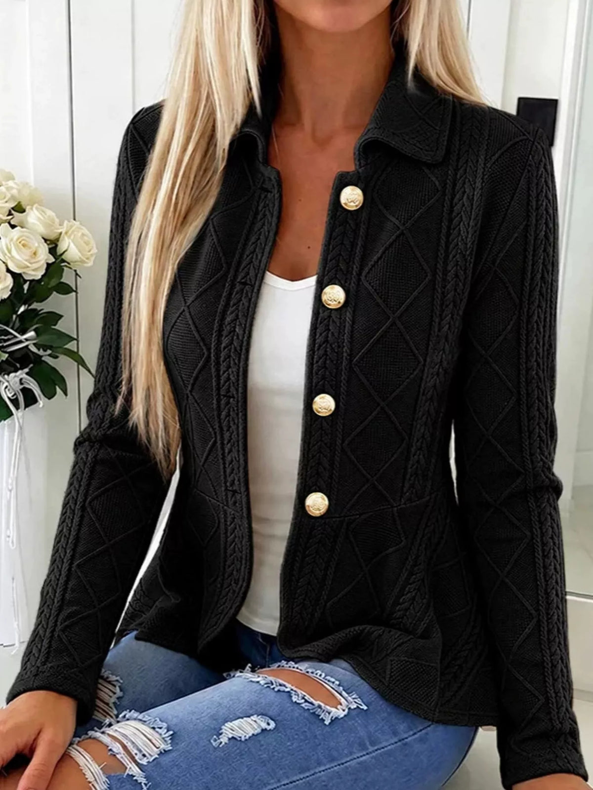 Black cable-knit button-up cardigan — front view