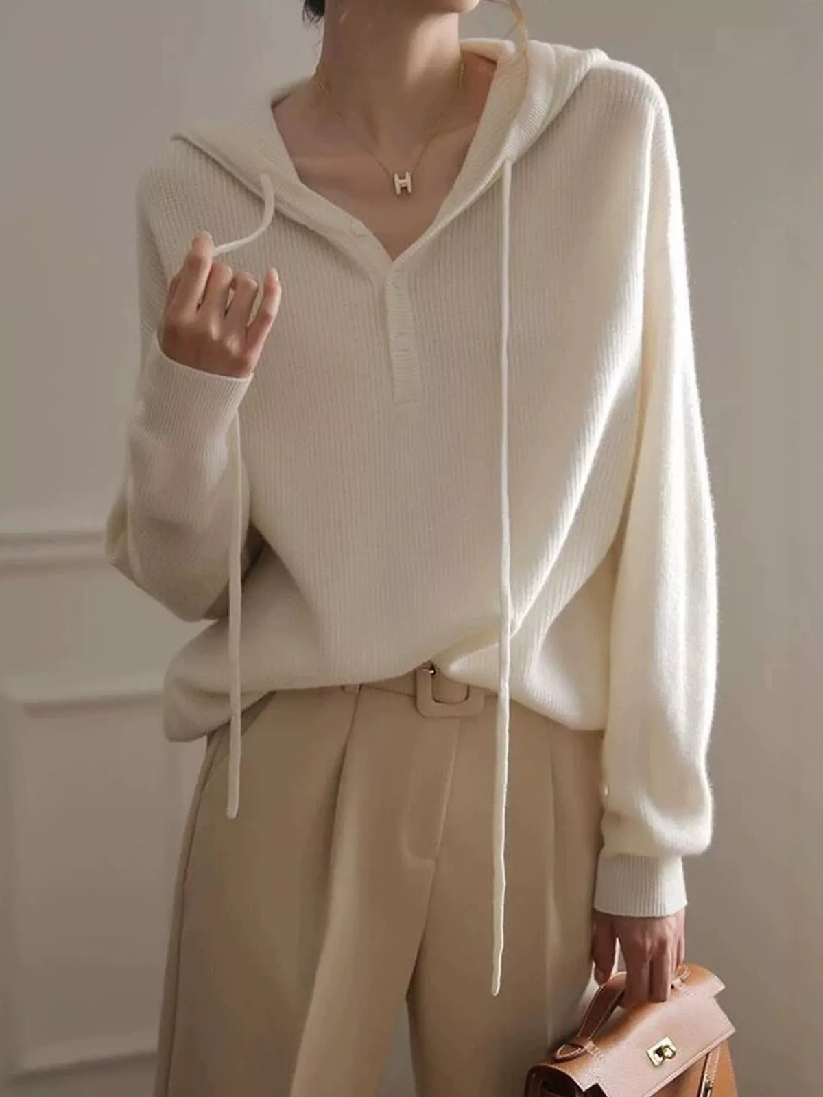 Hooded long sleeve sweater, front view on model