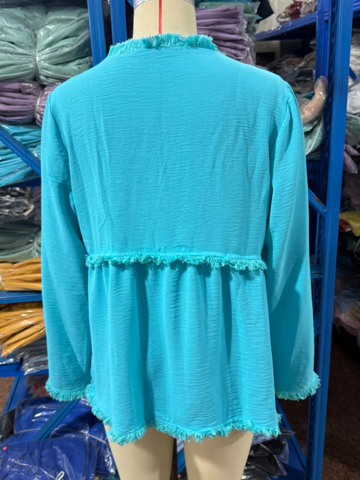 Fringe-trim blouse, turquoise mannequin back