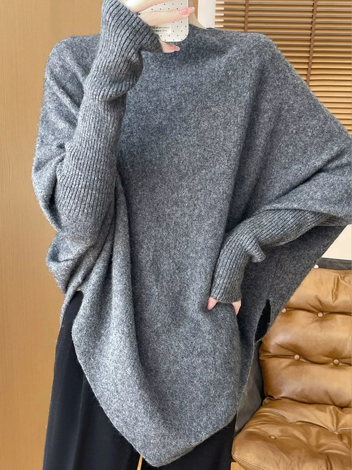Gray asymmetrical lantern sleeve sweater — front view