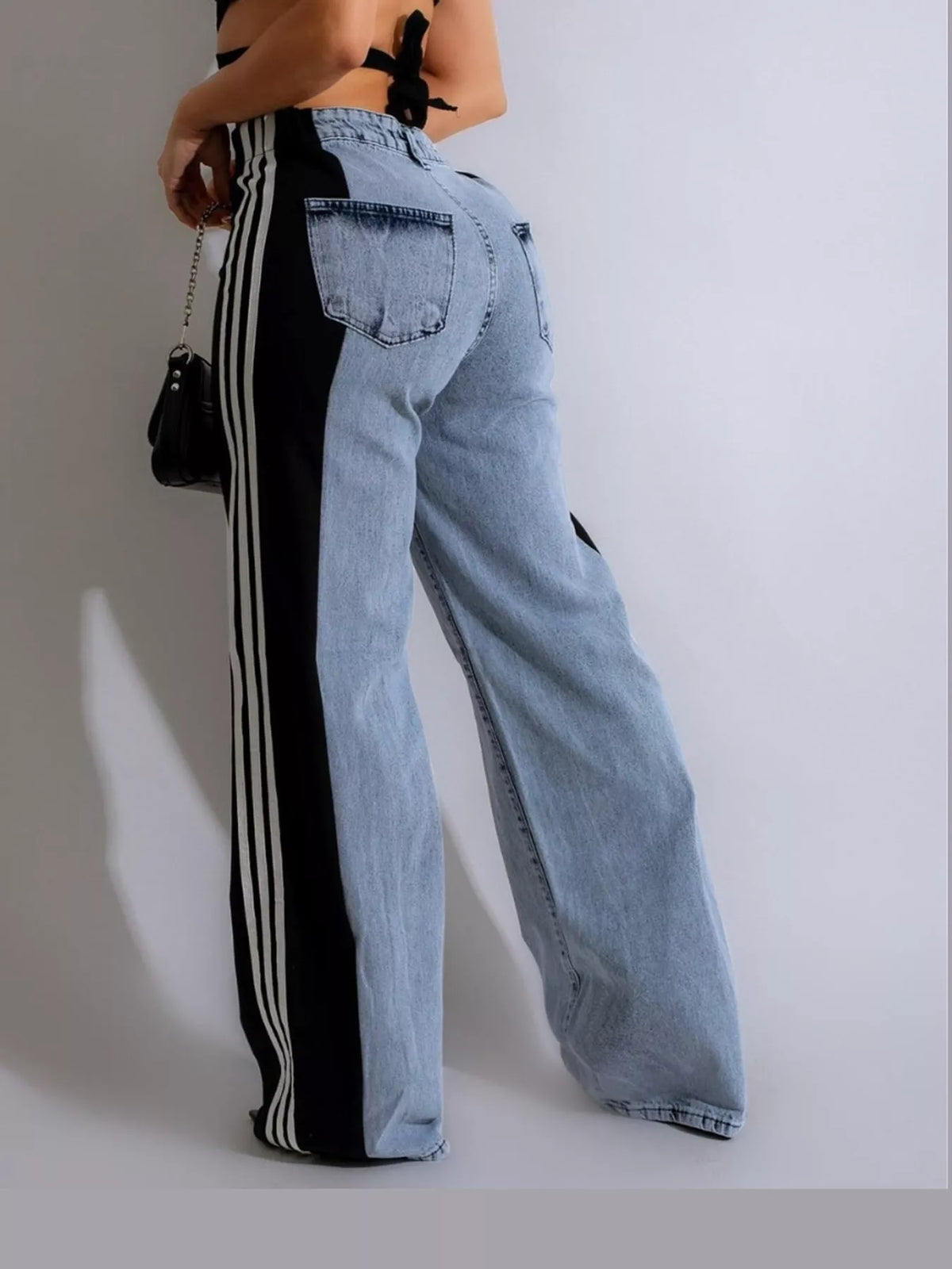 Black high-waisted wide-leg jeans with side stripe detail