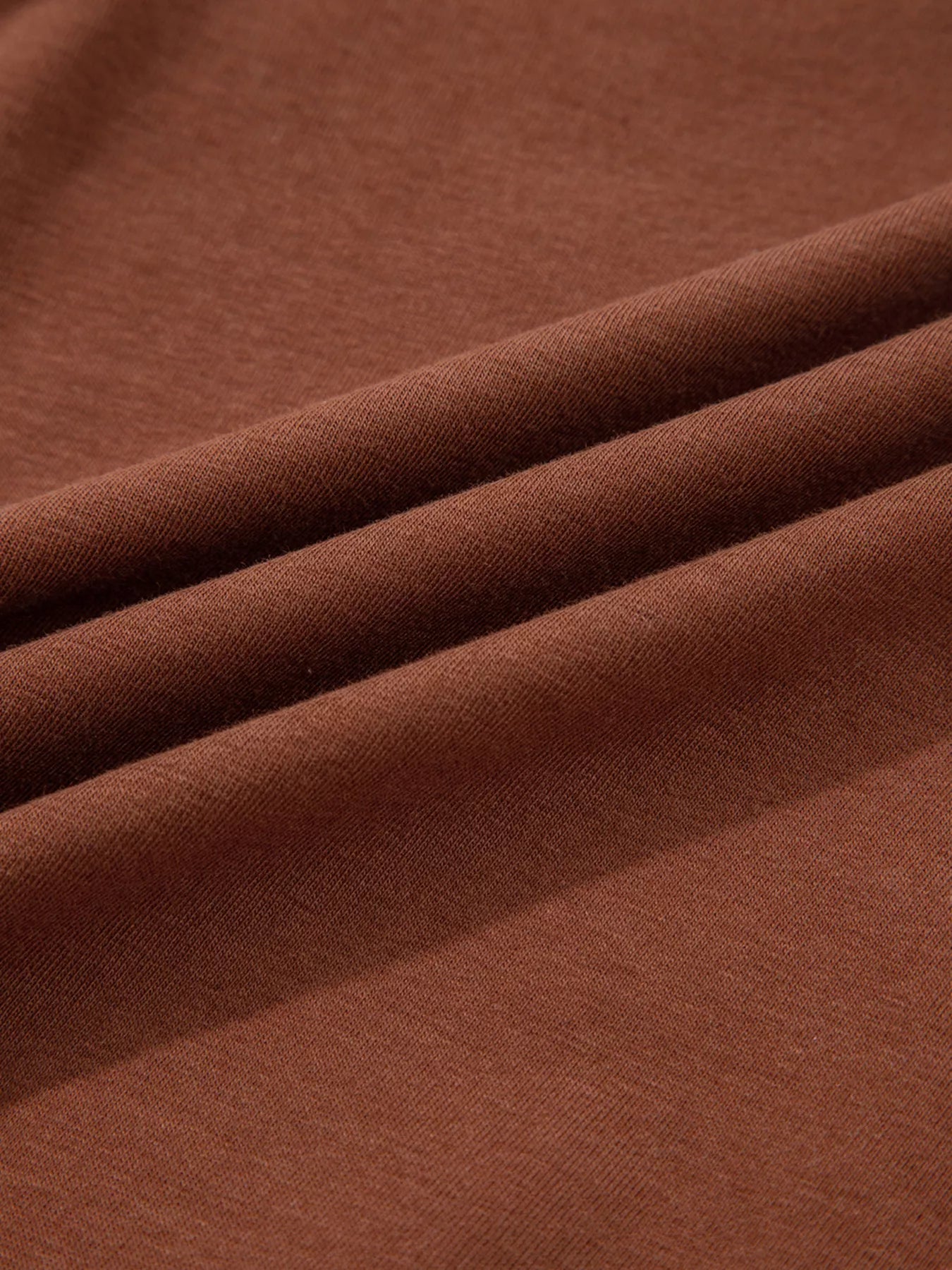Trendsi Raw Seam Detail Solid Color Long Sleeve Top -