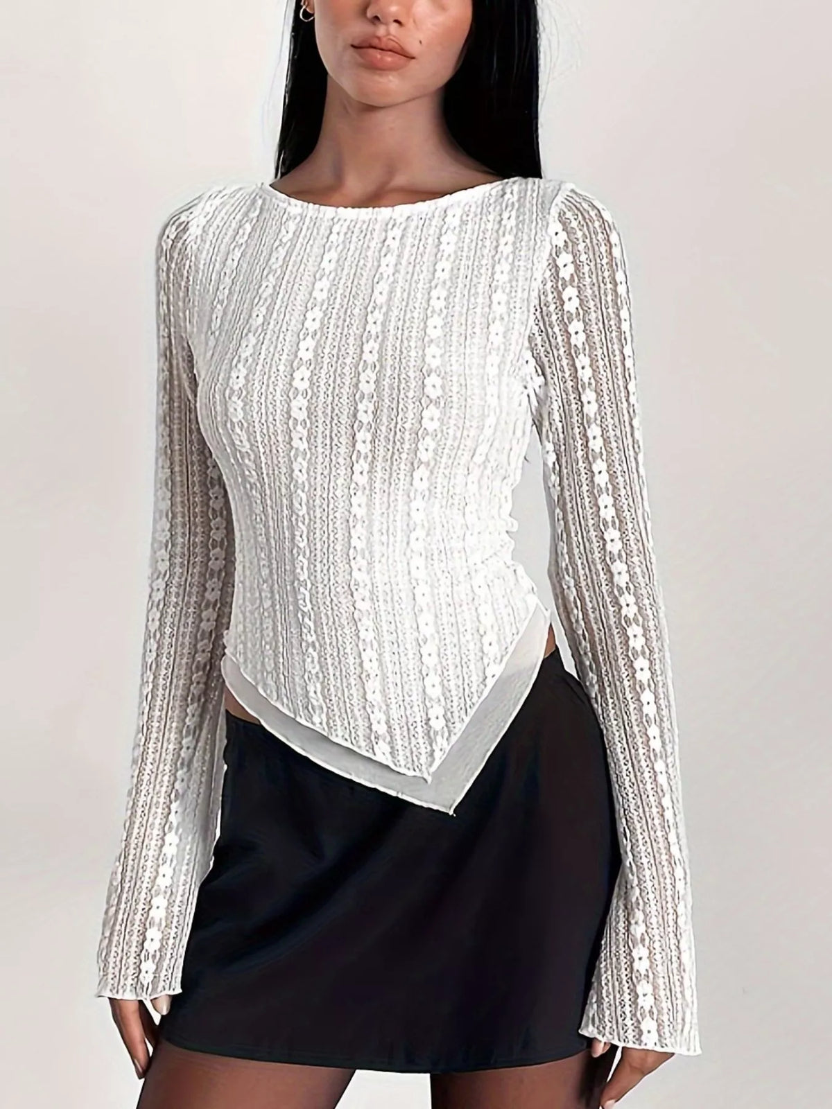 White lace blouse with asymmetric hem, standing front view