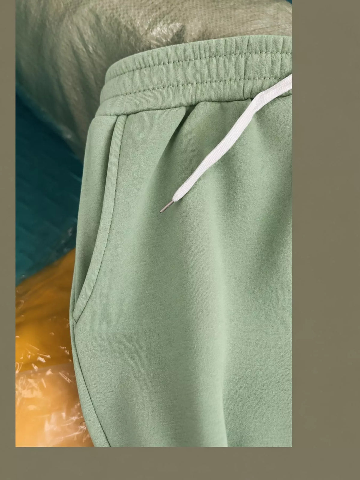 Mint green wide-leg pants with drawstring, detail view
