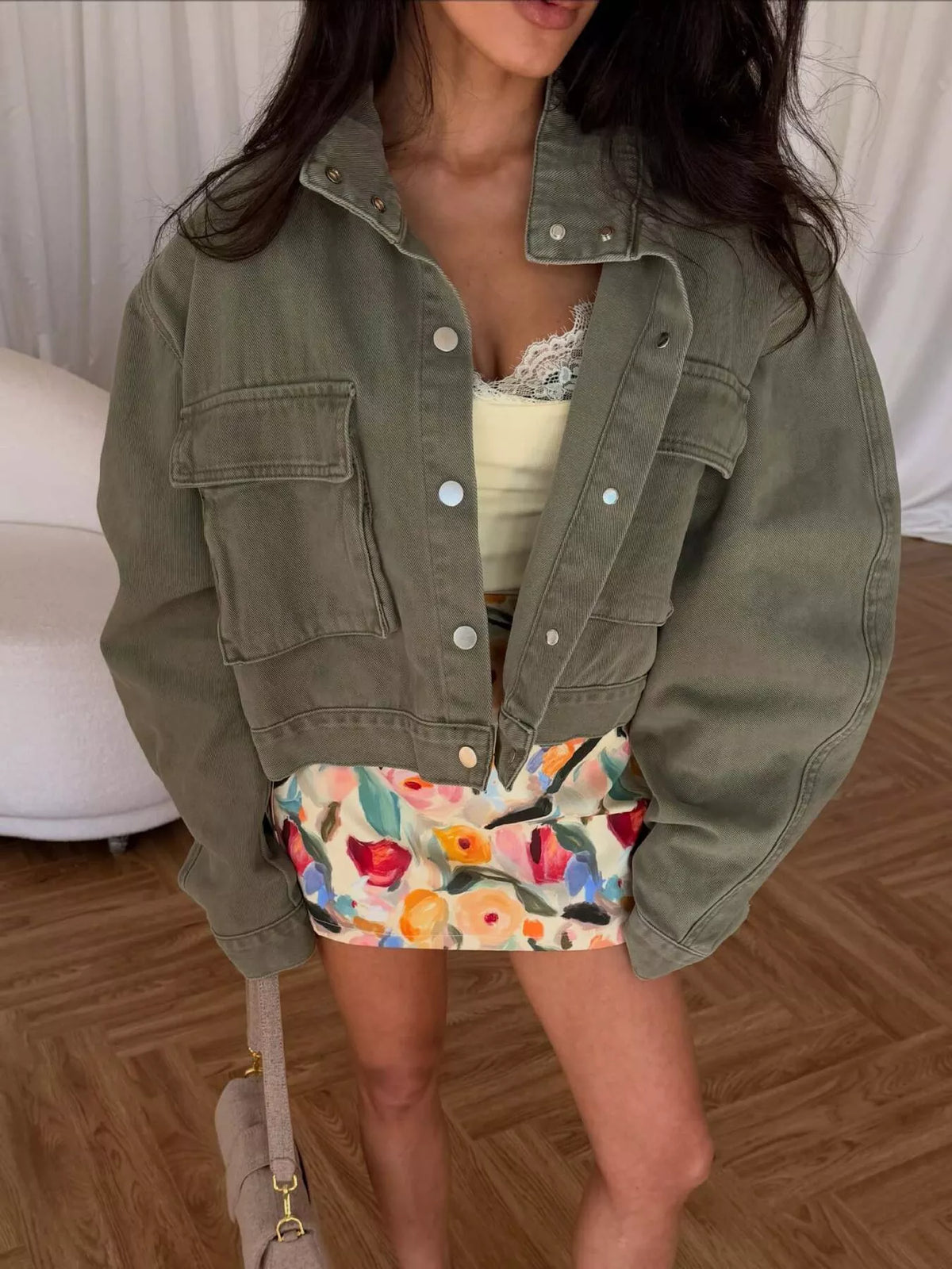 Olive oversized cropped denim utility jacket, front view showing utility pockets.