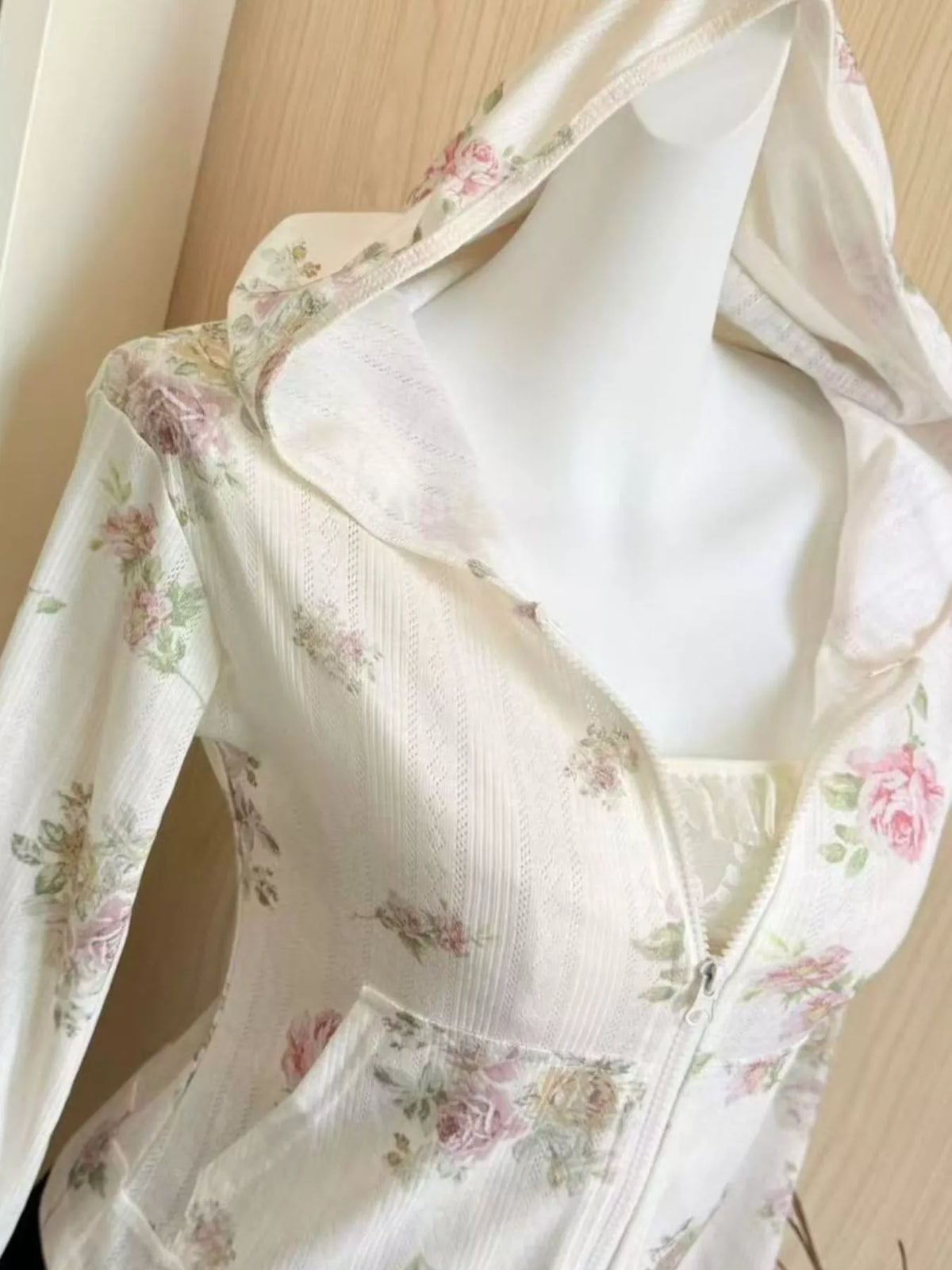 White floral print zip-up knit hoodie, detail view