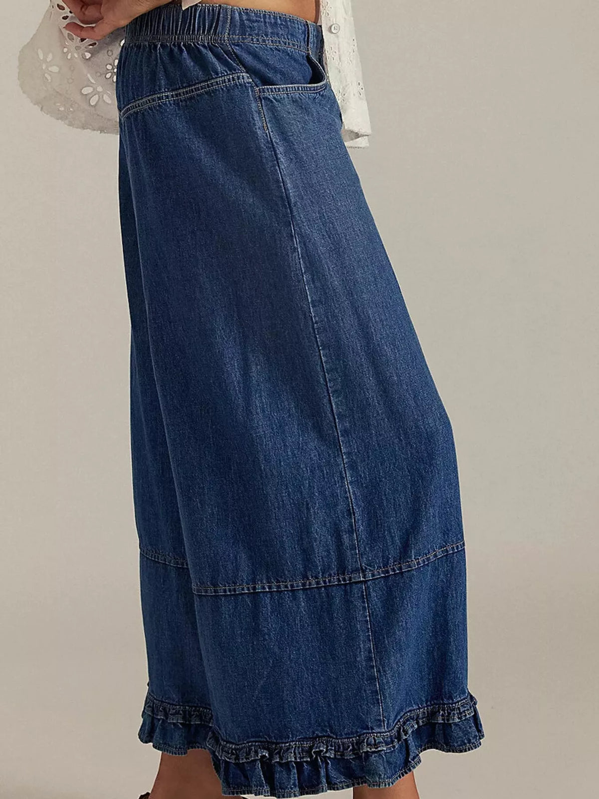 Blue wide-leg ruffle-hem jeans, side view