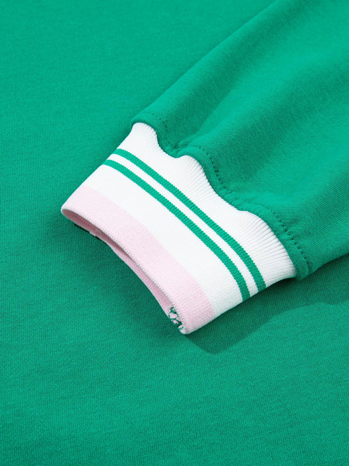 Green sweatshirt with contrast striped ribbed trim, cuff detail