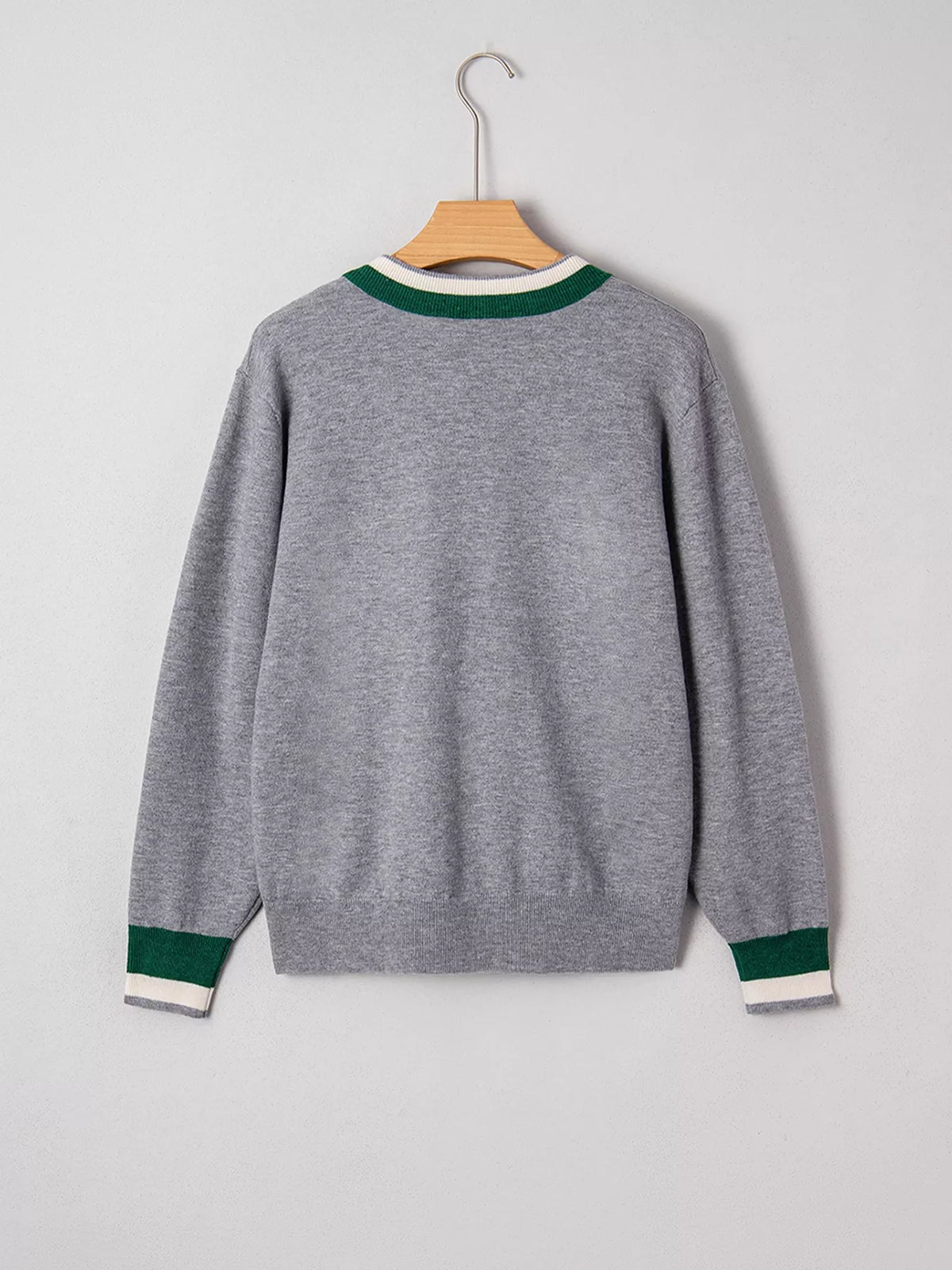 Gray v-neck sweater with striped trim, back on hanger.
