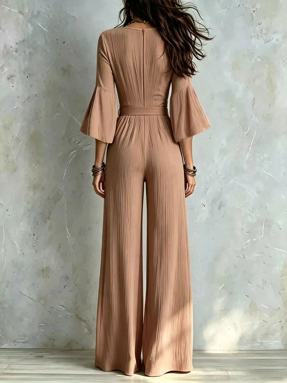 Brown pleated wide-leg jumpsuit with tie-waist, back view