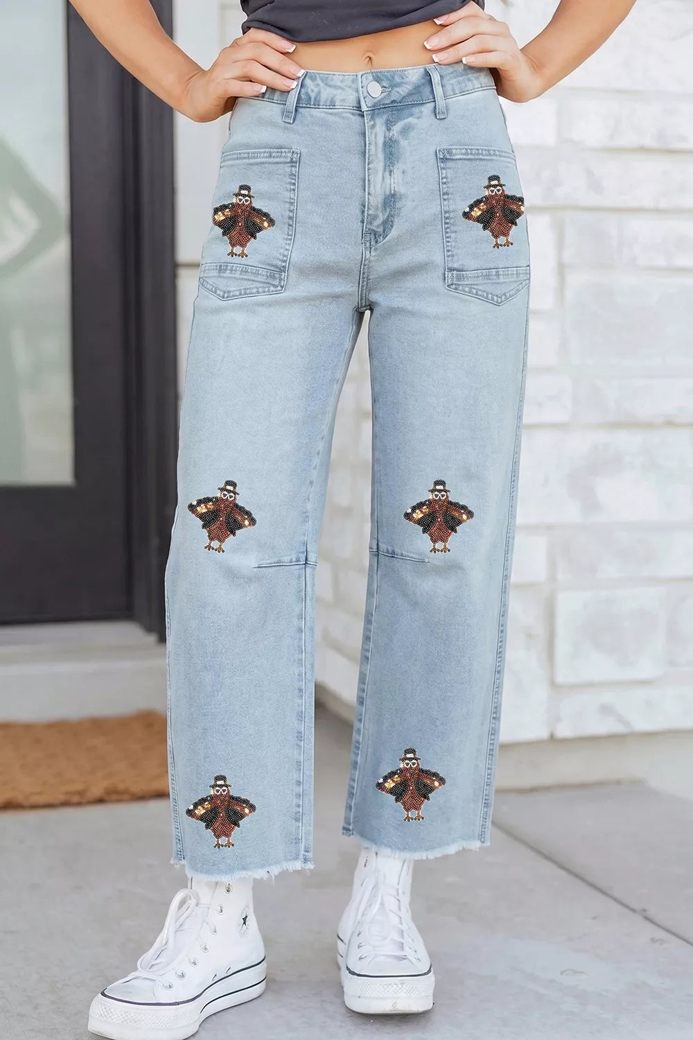 Light blue sequin turkey raw-hem ankle jeans, front view showing ankle-length hems.
