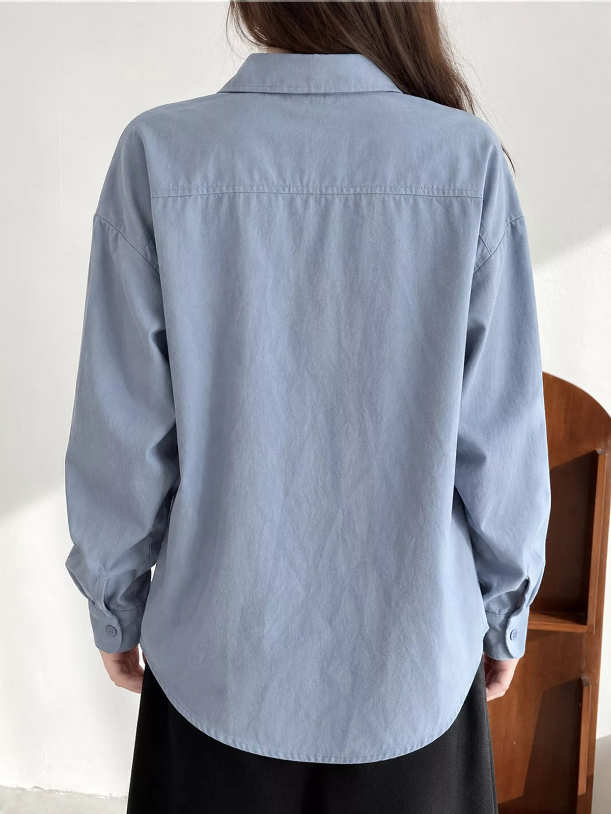 Blue oversized button-down long sleeve shirt, back view