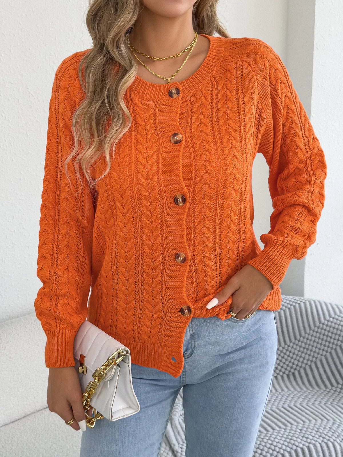 Orange cable knit button-front cardigan