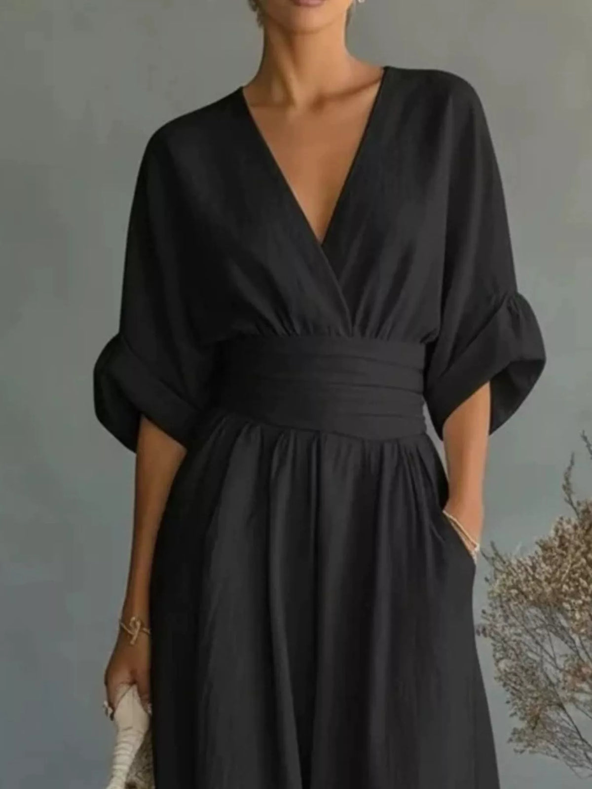Black V-neck wide-leg jumpsuit, bodice detail