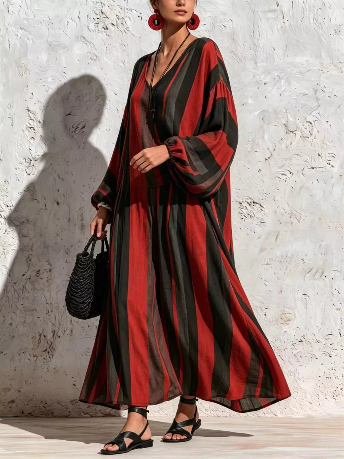 Red and black striped v-neck top and wide-leg pants set, angled full-length view.