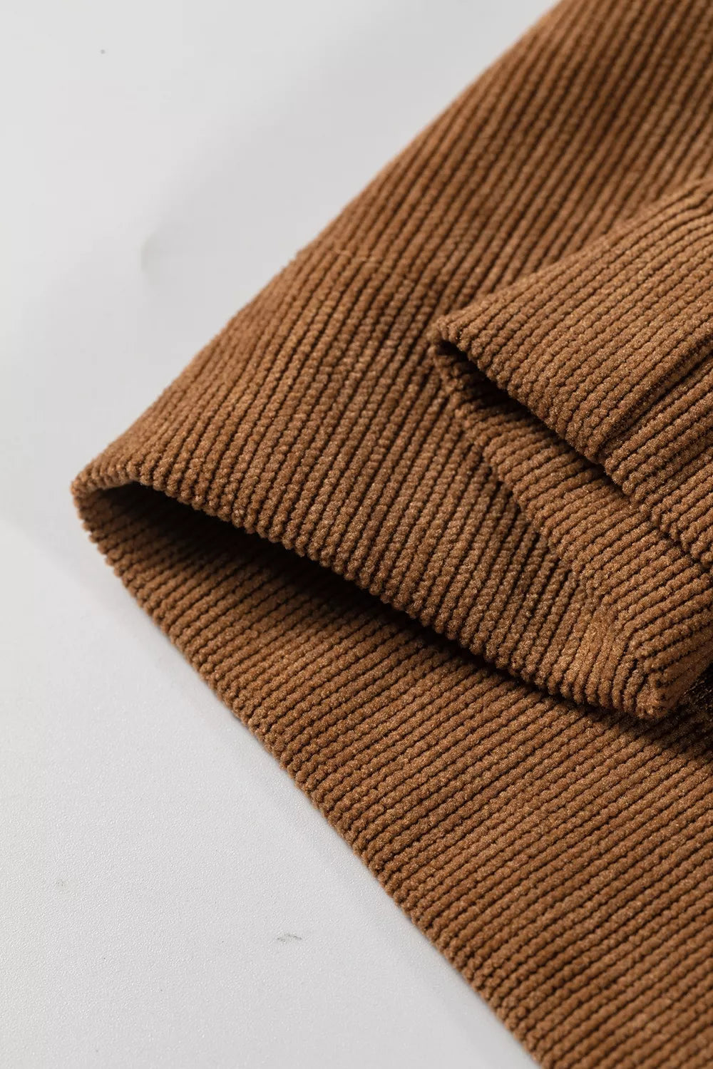 Brown button-detail wide-leg pants, hem detail
