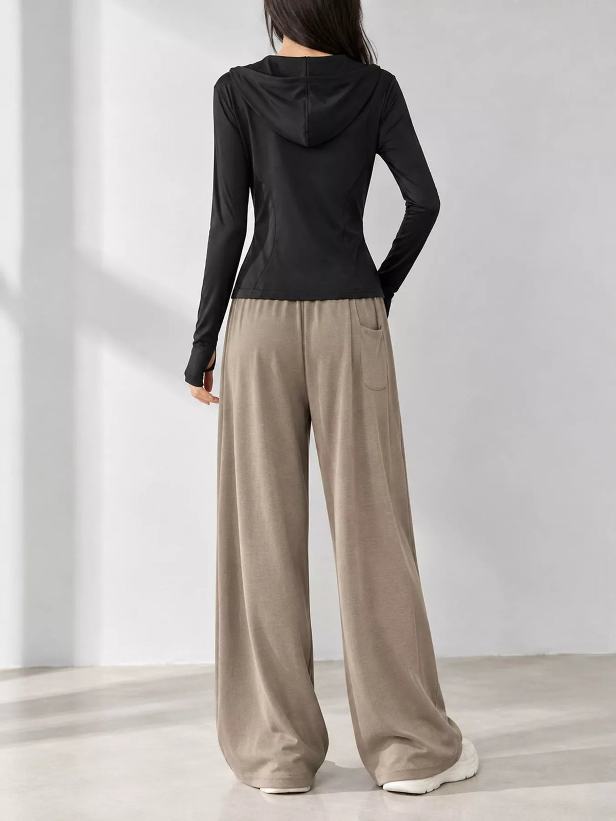 Black quick-dry zip-up jacket, back view
