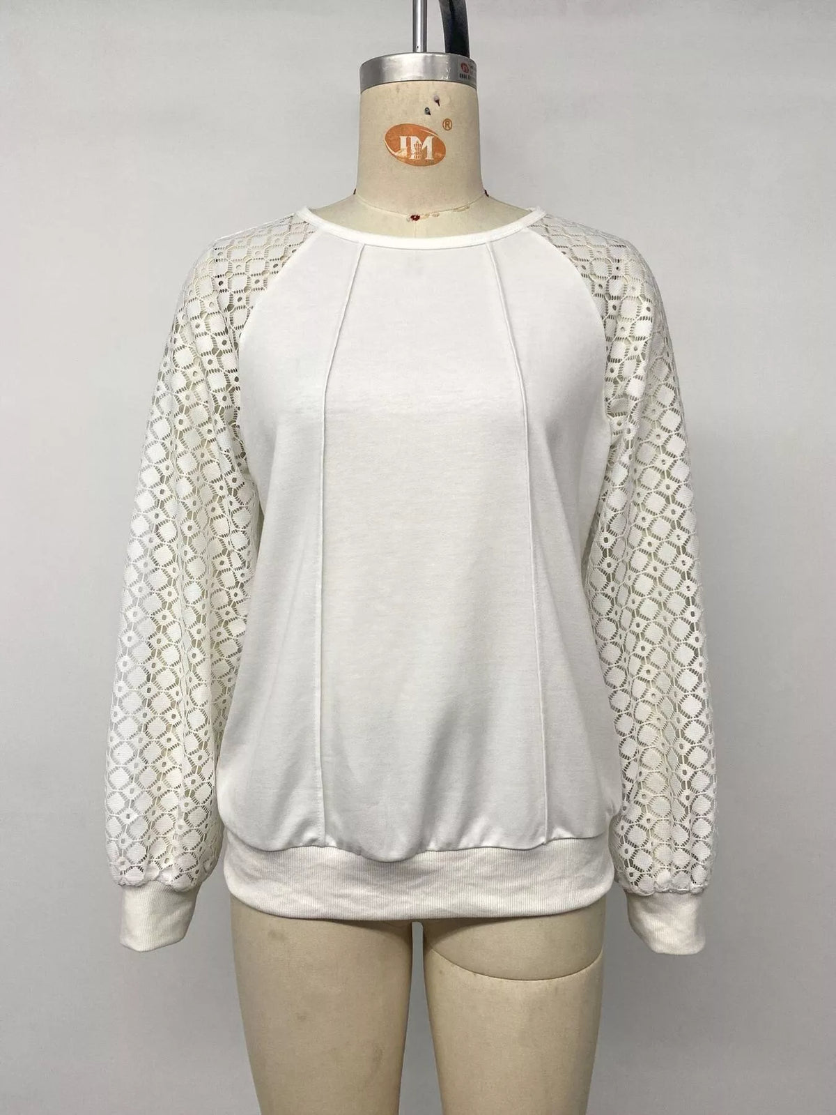 White lace raglan sleeve sweatshirt, front on mannequin