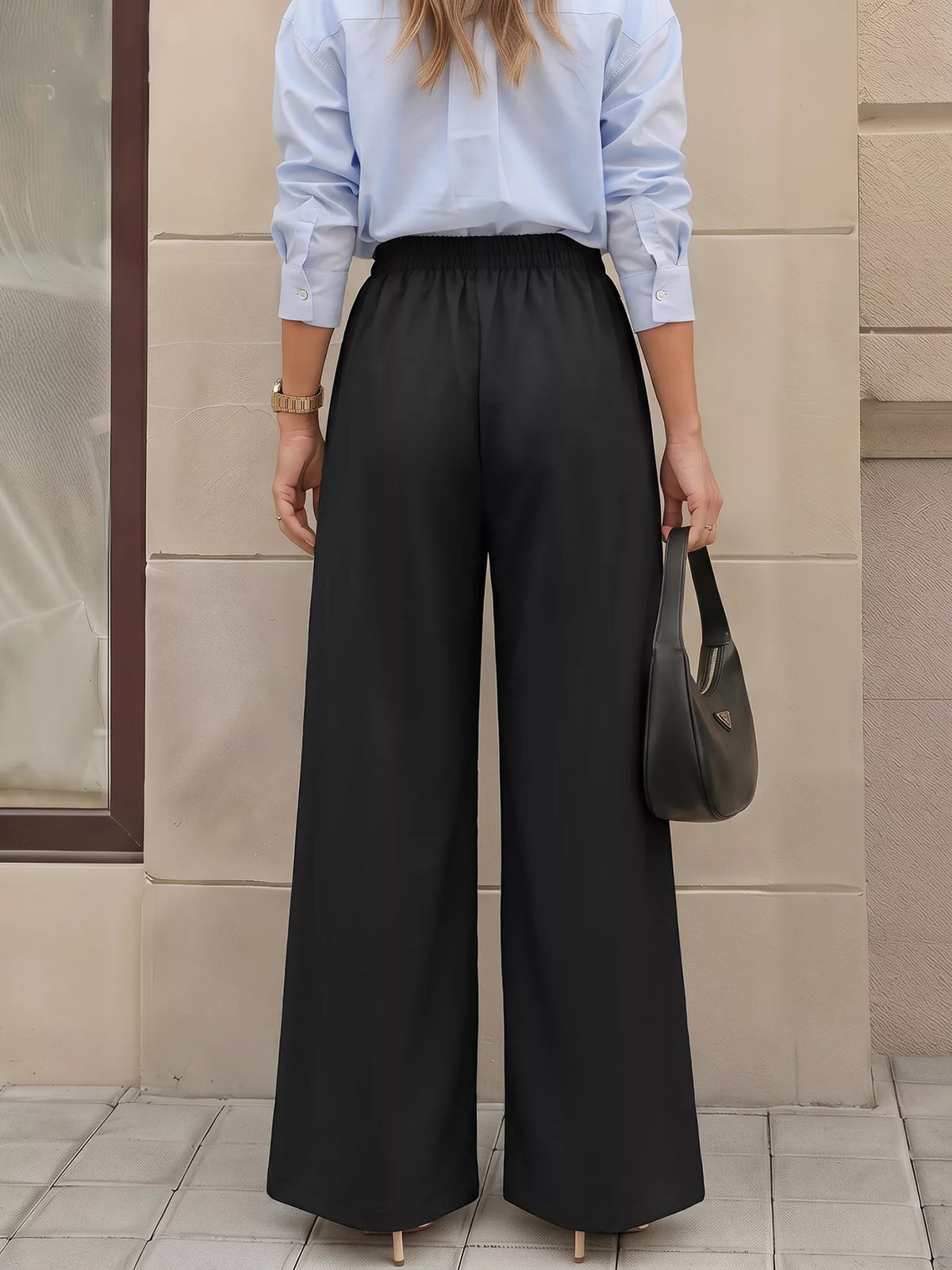Black wide-leg pants with overlap front, back view