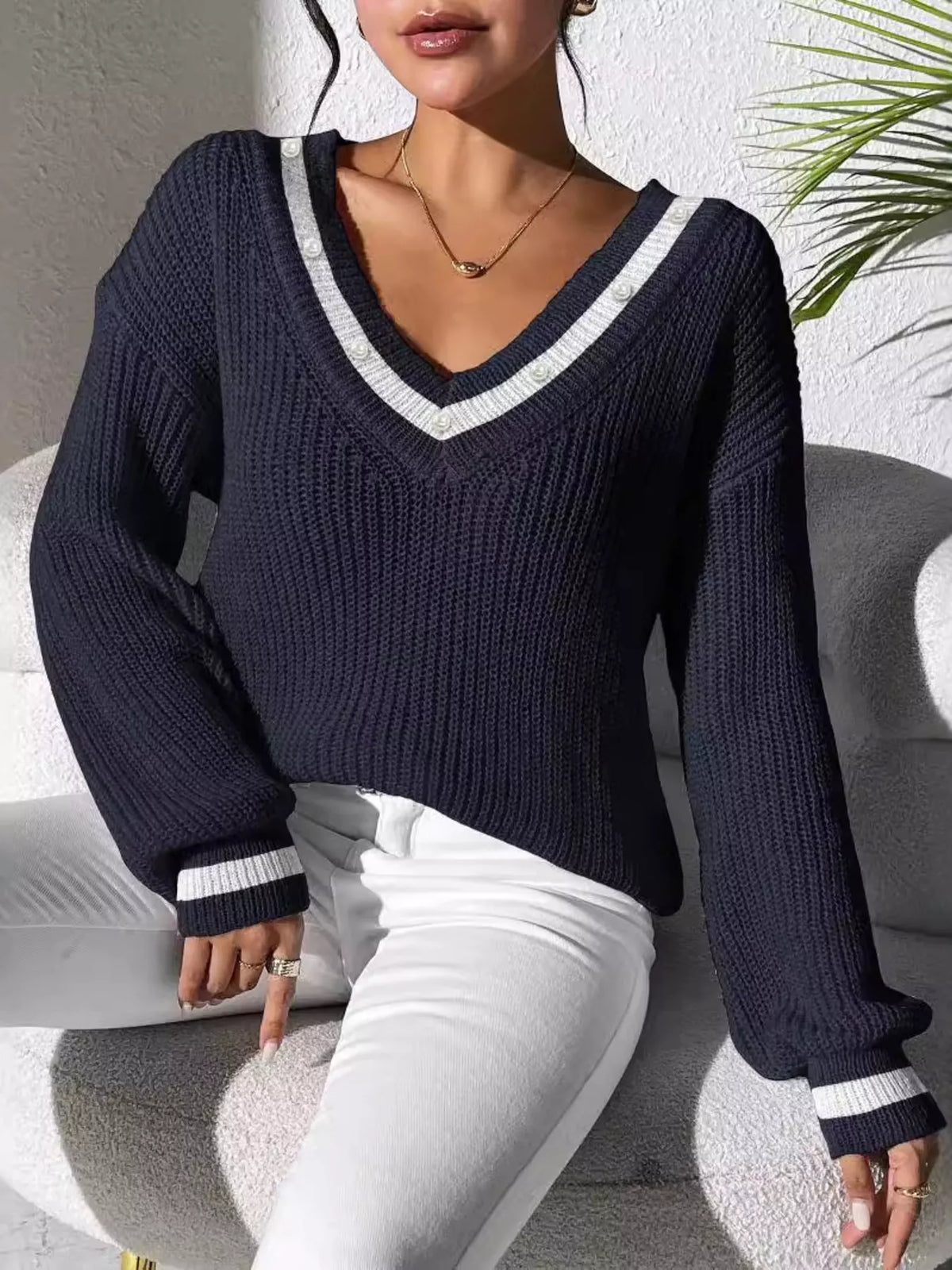 V-neck contrast-trim sweater with pearl decor in navy, seated front view