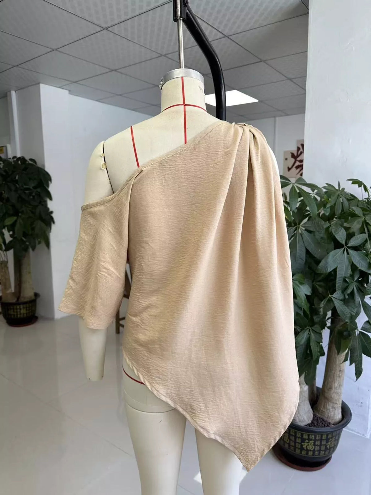 One-Shoulder Knot Detail Blouse in beige, dress form back view