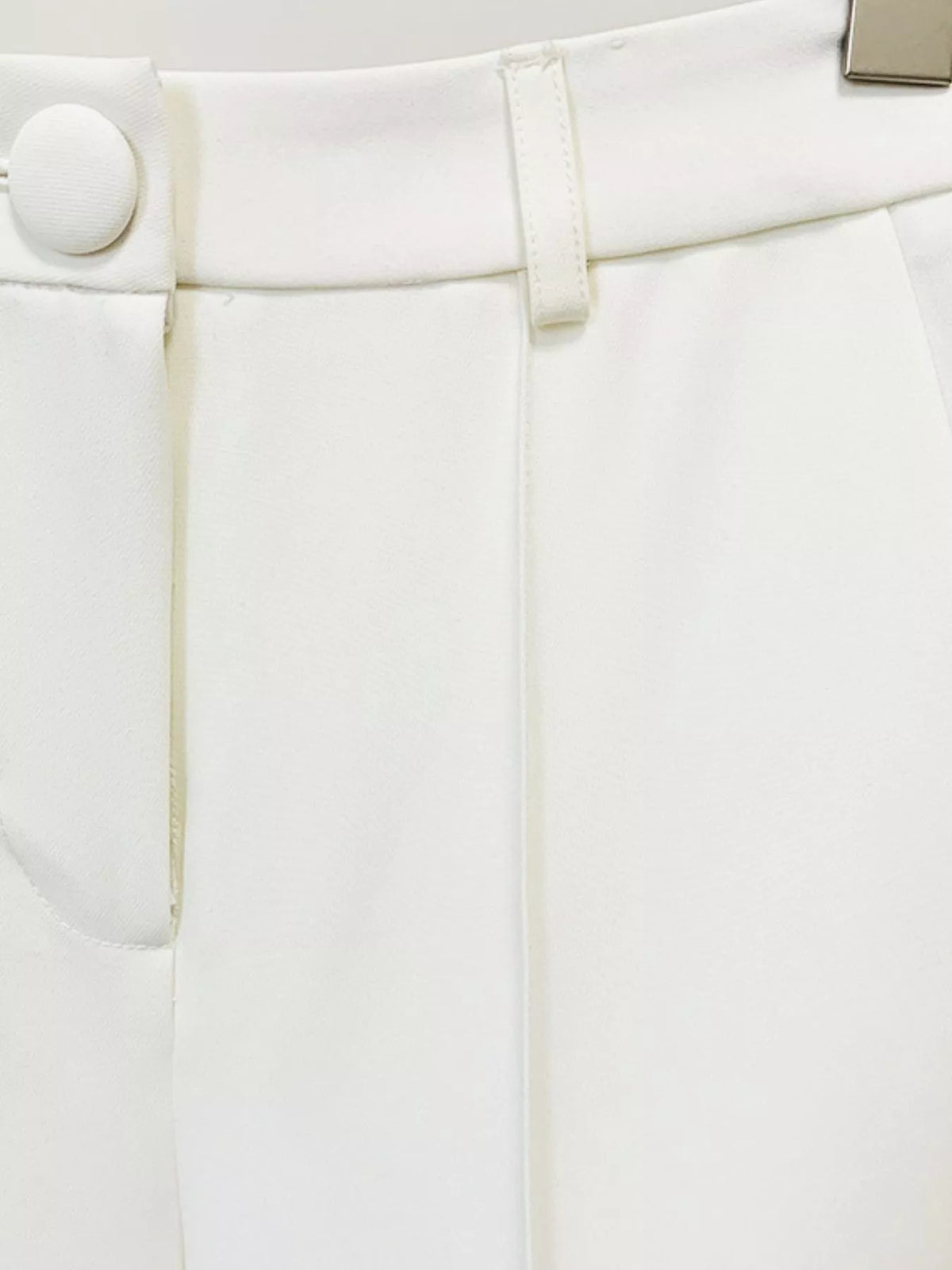 White one-button blazer and flared pants set, detail view