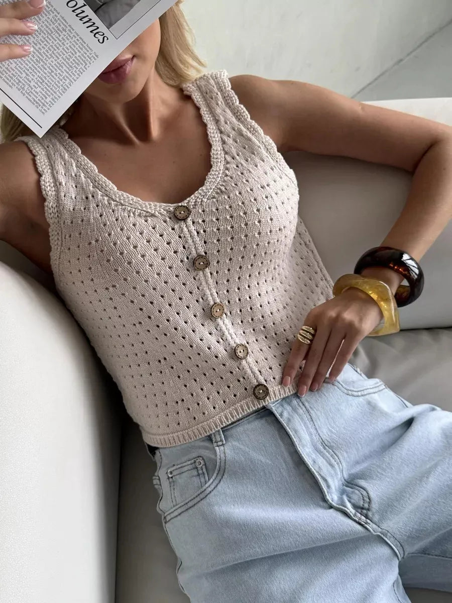 Ivory openwork button-detail knit tank top, reclining front view.