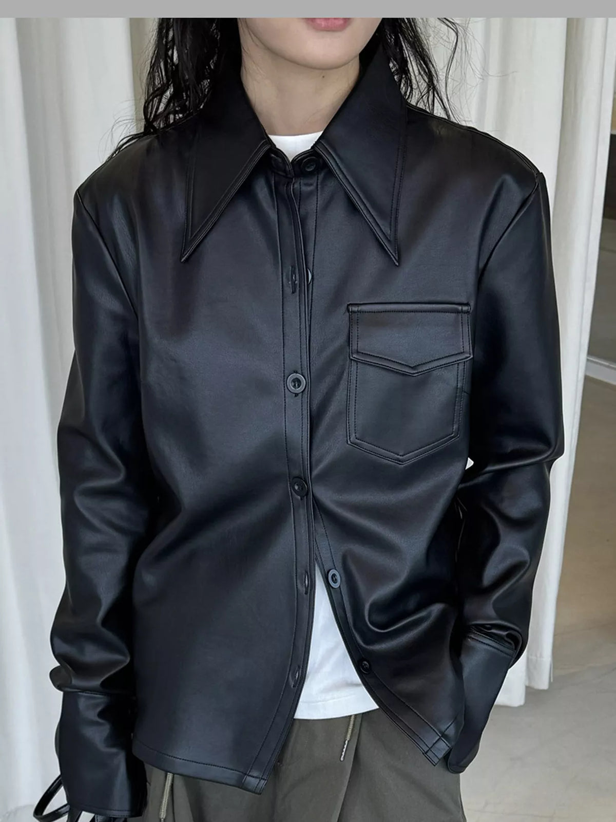 Black faux leather button-front jacket — front view