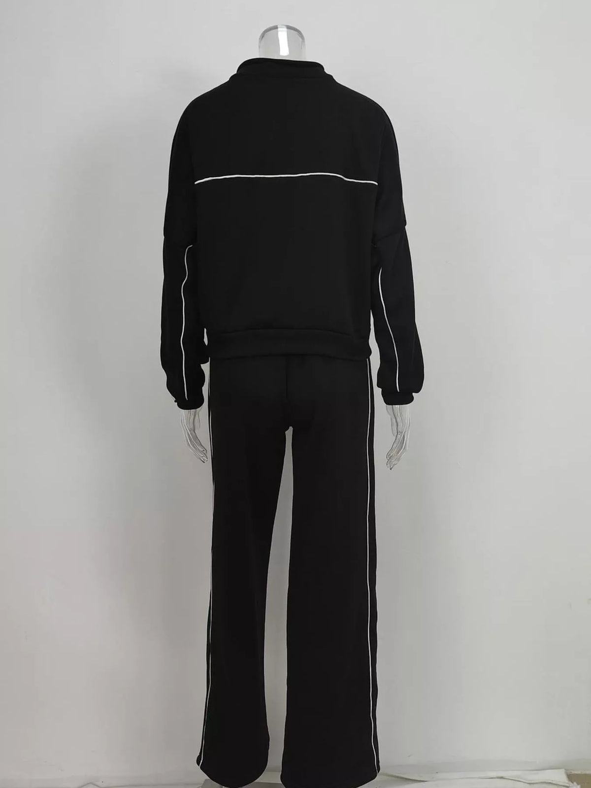 Black zip-up jacket and wide-leg pants set, back view