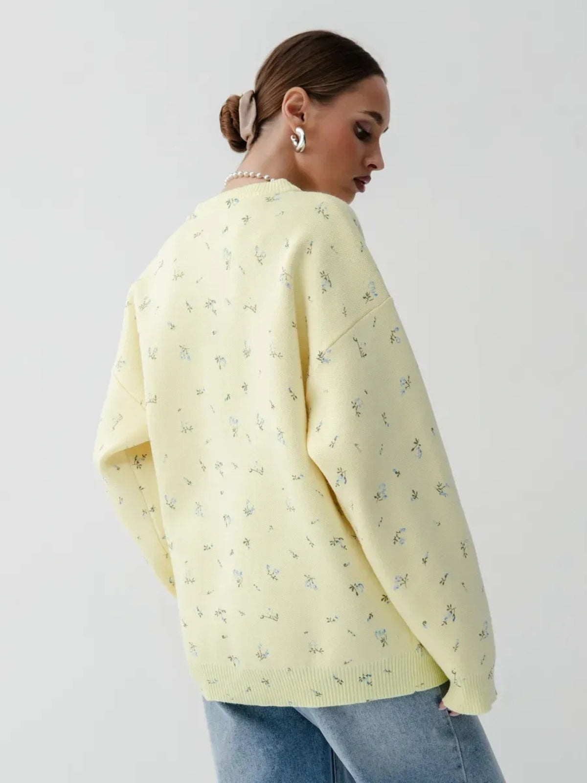 Yellow floral dropped-shoulder oversized sweater, back view.