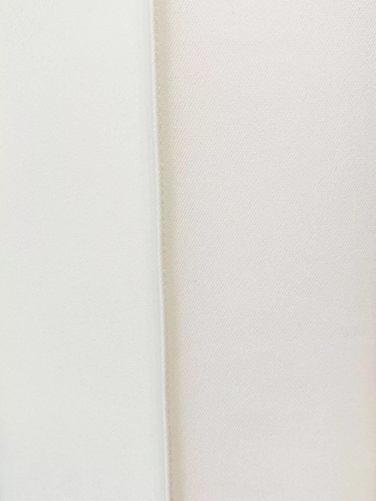 White one-button blazer and flared pants set, detail view