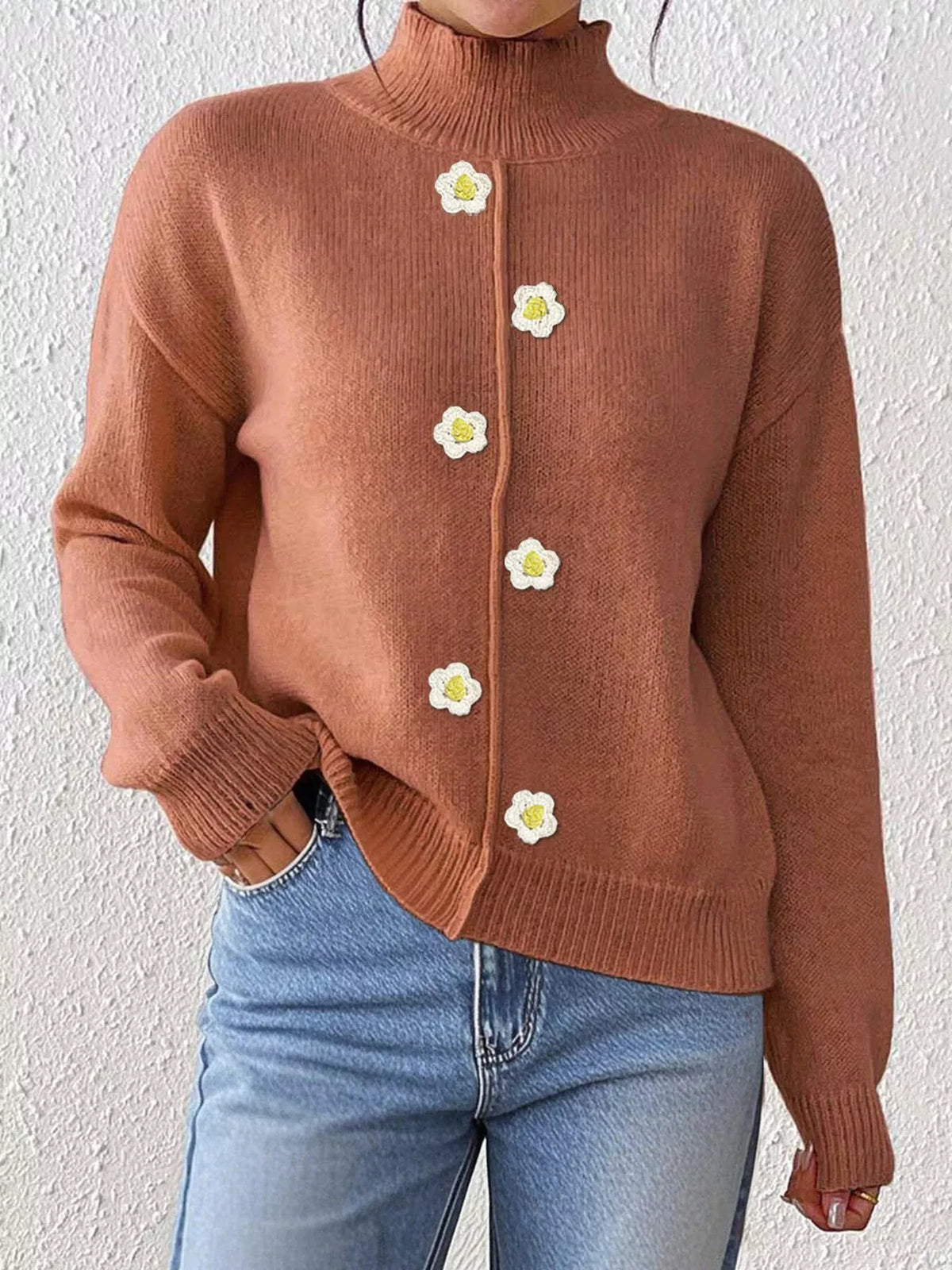 Rust floral applique mock-neck sweater, front showing floral appliques.