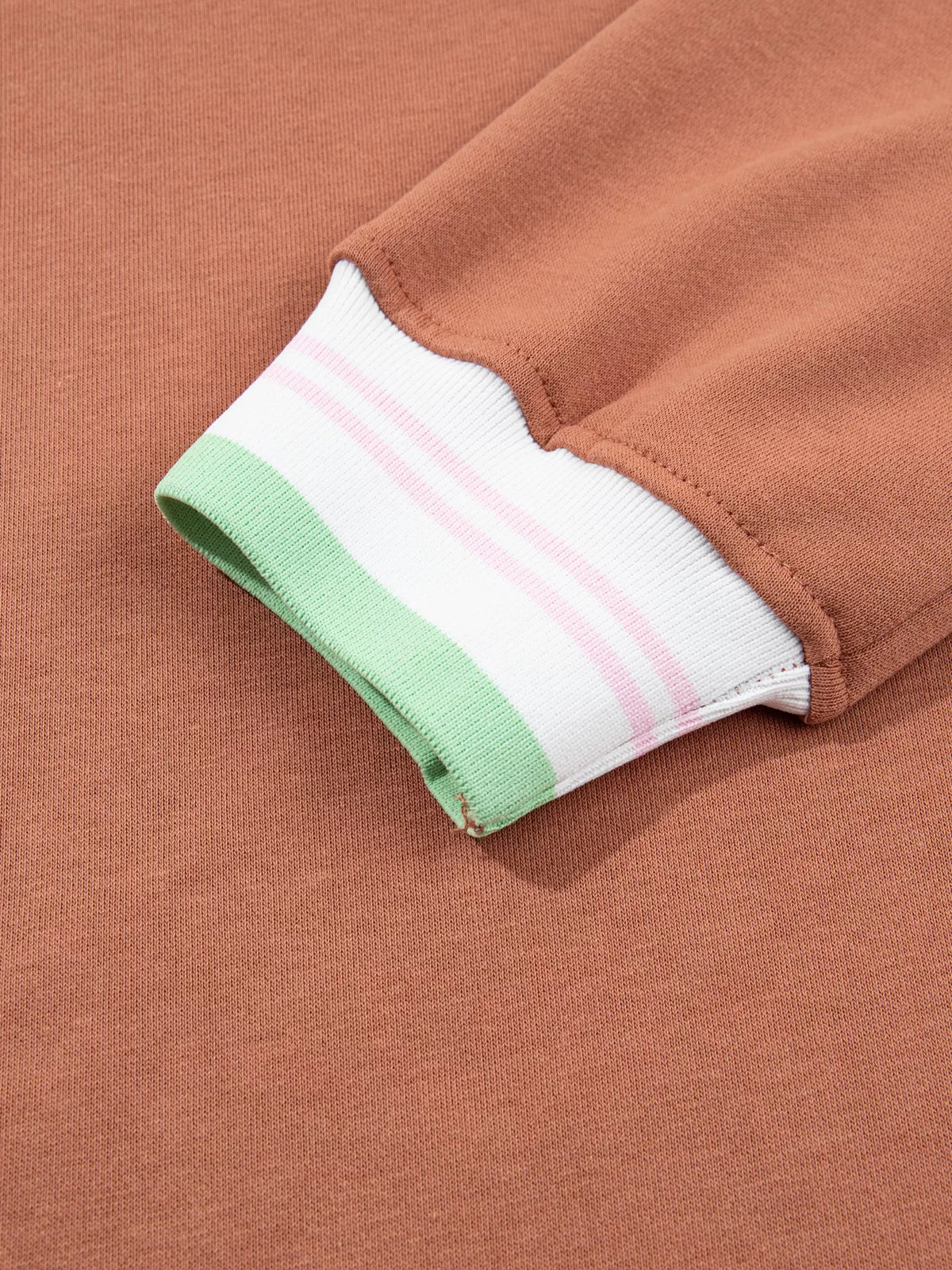 Brown sweatshirt with contrast striped ribbed trim, cuff detail