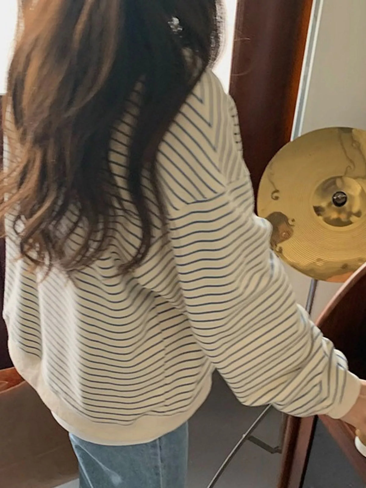 Cream and blue striped long sleeve crewneck t shirt, side view