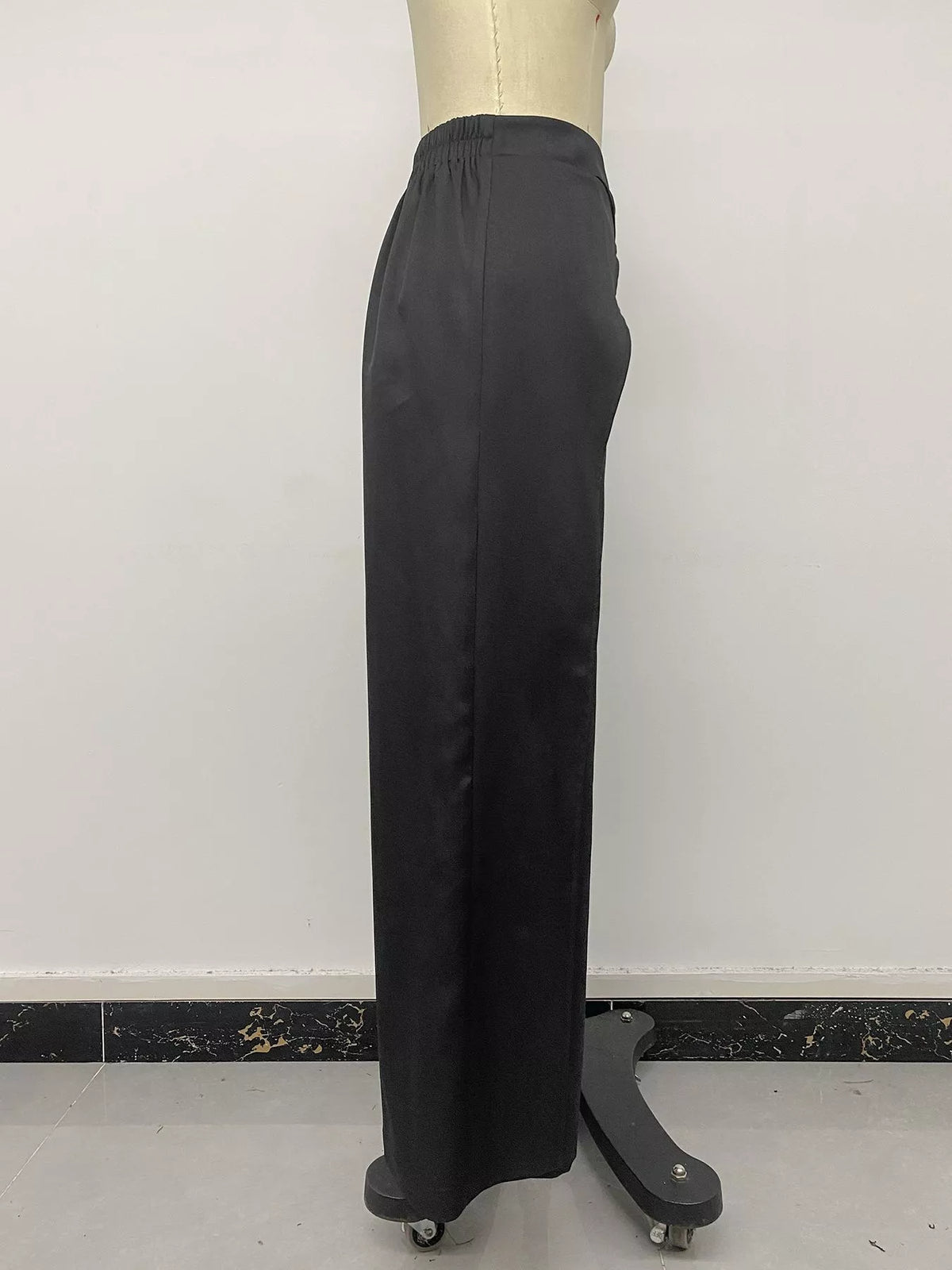 Black wide-leg pants with overlap front, side on mannequin