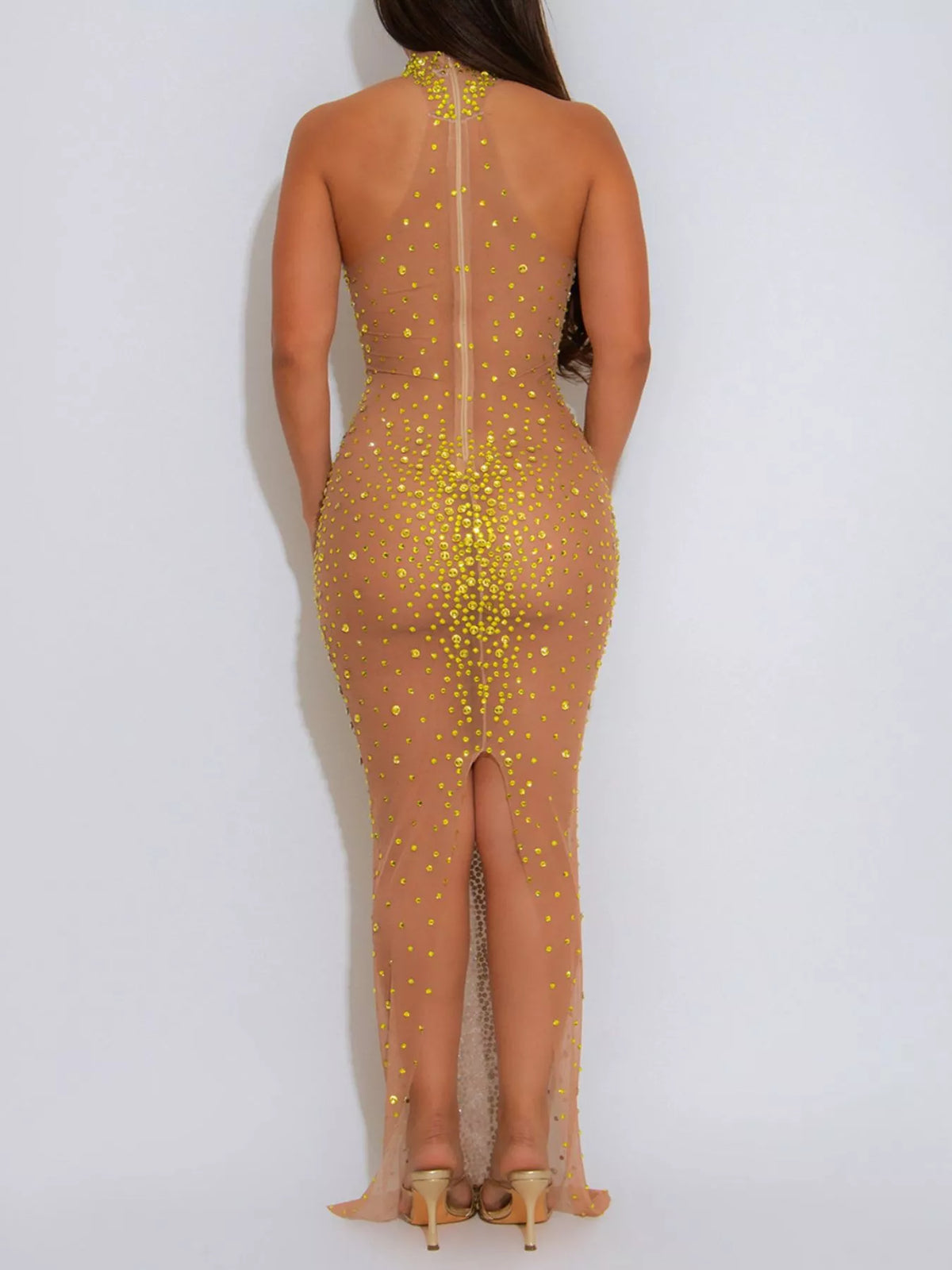 Gold rhinestone mesh maxi dress with back slit, back slit view.