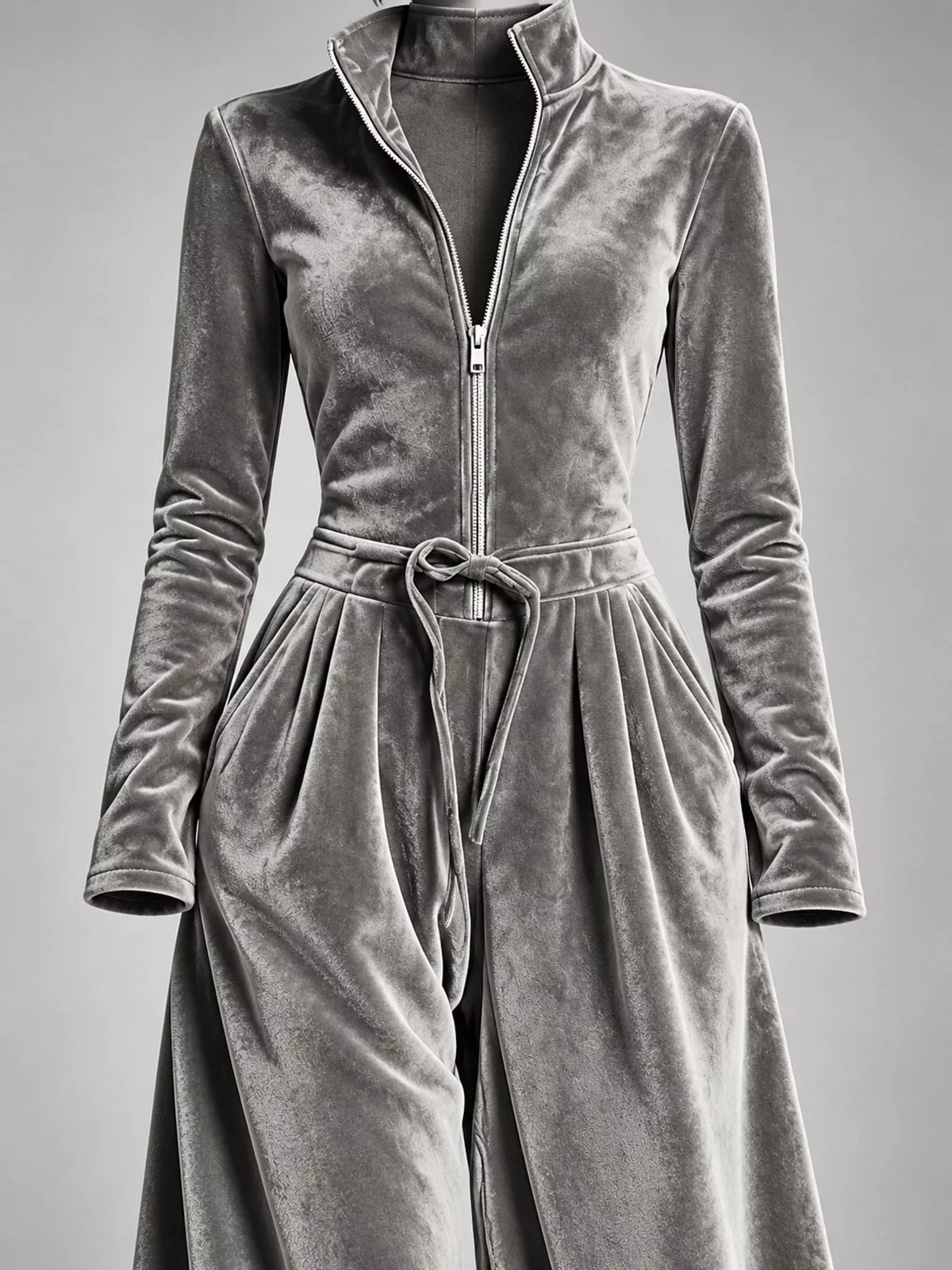 Gray velvet zip up jumpsuit with tie waist, detail view