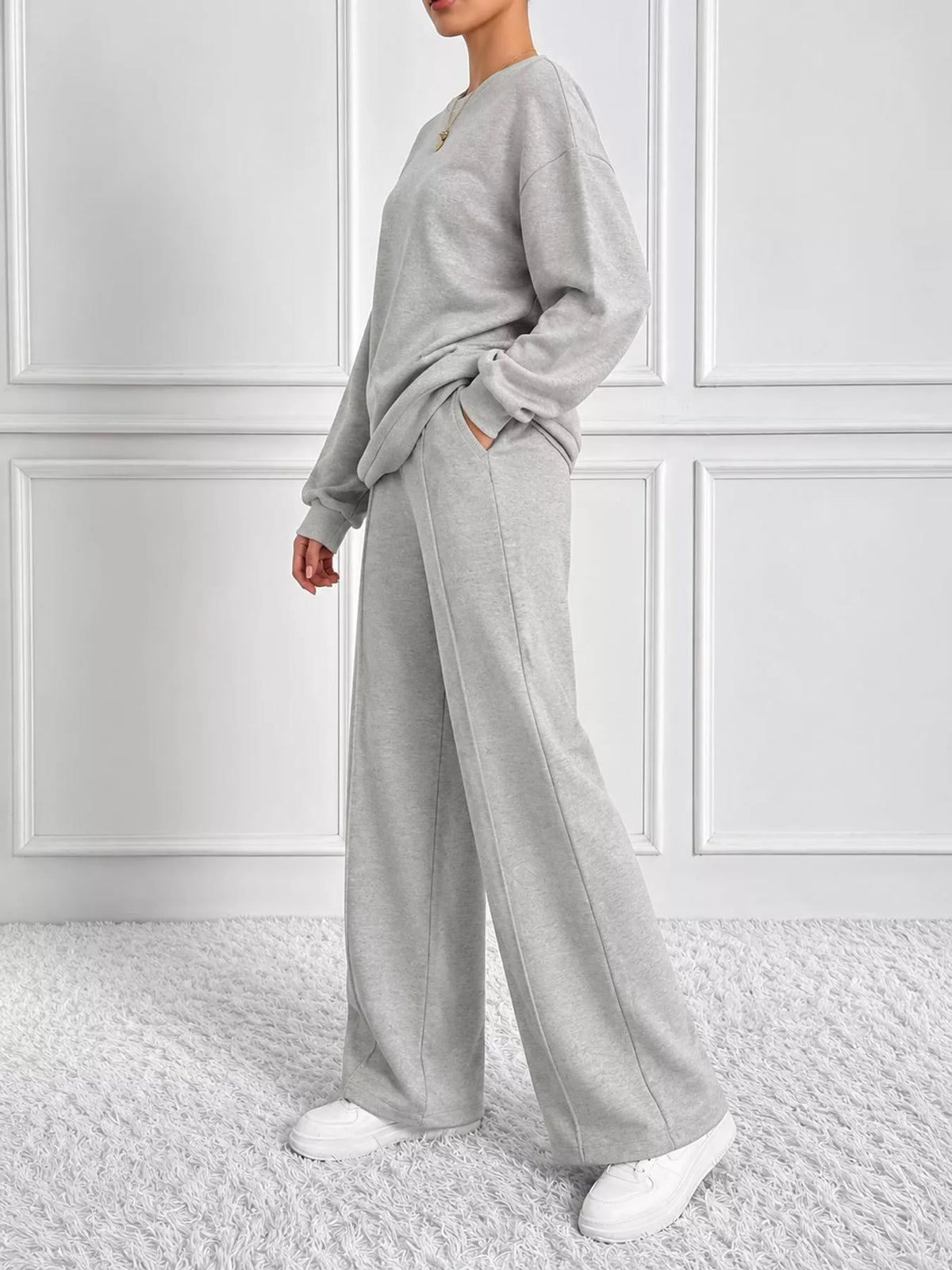 Light gray oversized sweatshirt and wide-leg pants set — side view