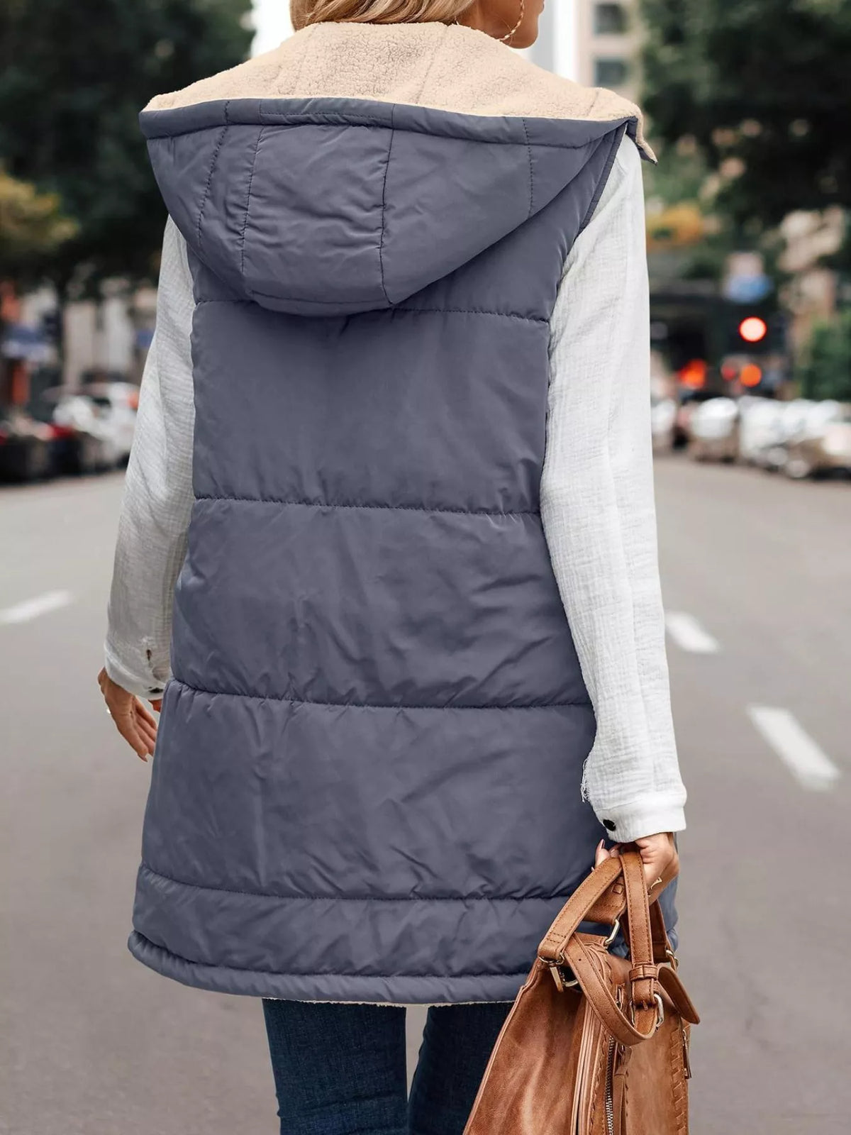 Blue-gray hooded sherpa-lined puffer vest, back view