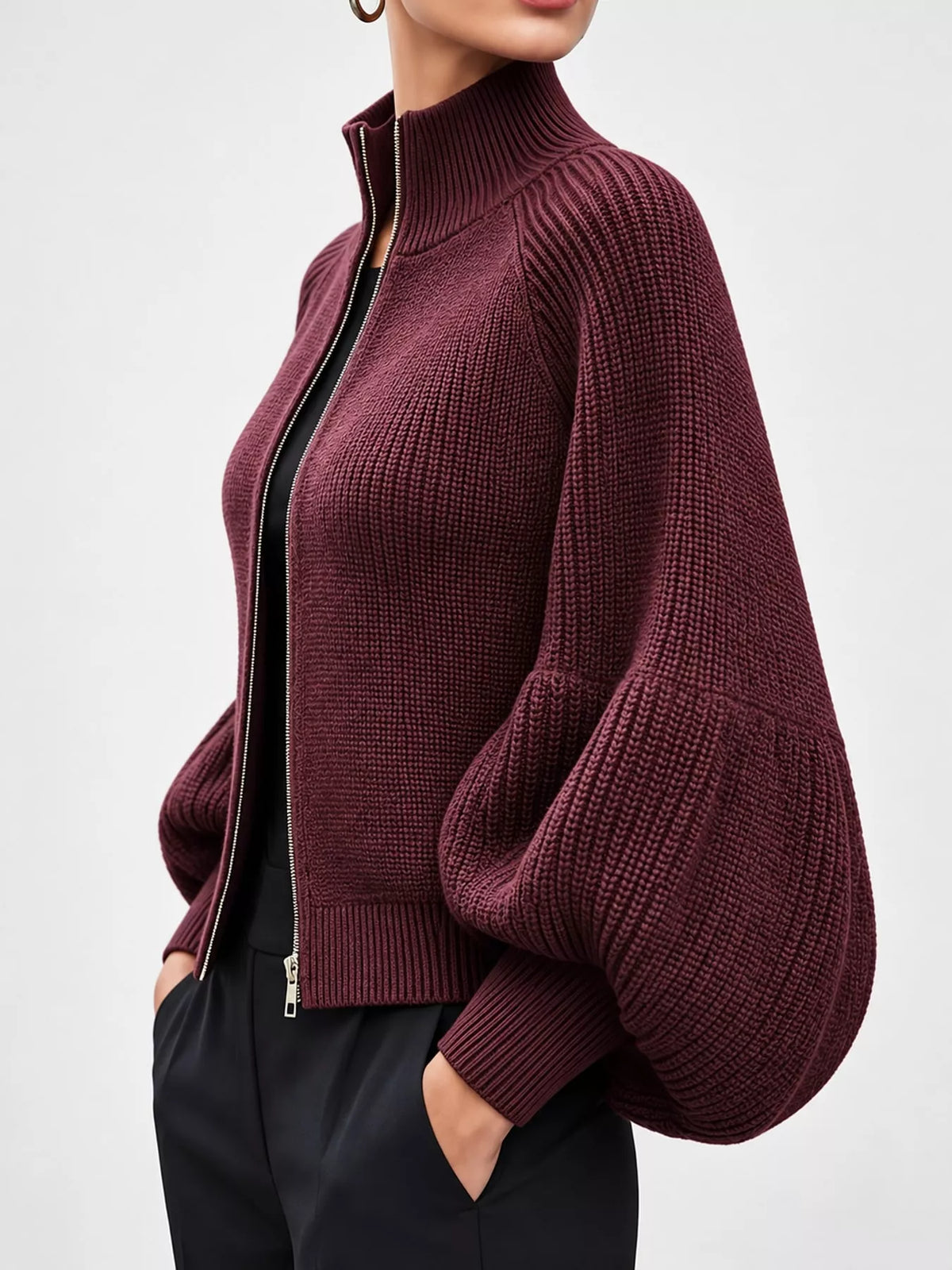 Burgundy ribbed knit zip-up cardigan with lantern sleeves, side view